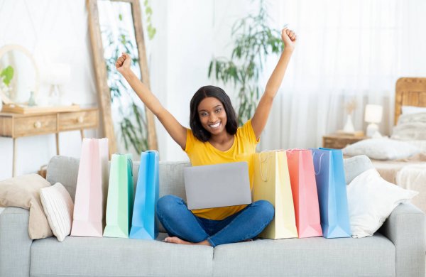 depositphotos_429290508-stock-photo-excited-black-lady-shopping-online